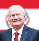 Description: A person in a suit and tie  AI-generated content may be incorrect.